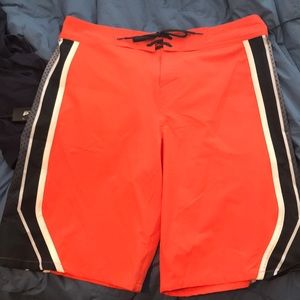 UA orange boardshorts